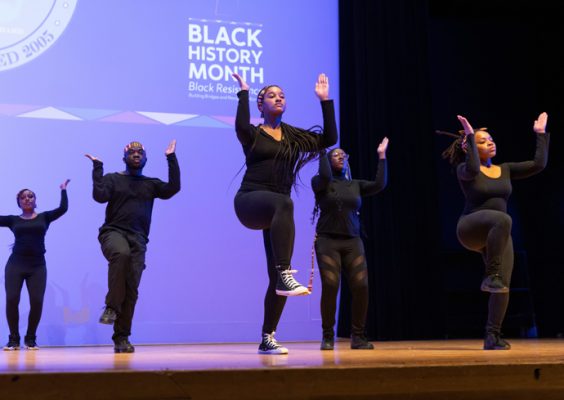 Students performing during Syracuse University's Black History Month kickoff celebration.