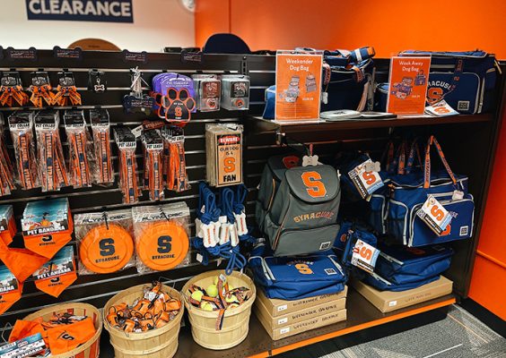 Shelf in the campus store full of Syracuse branded items for pets