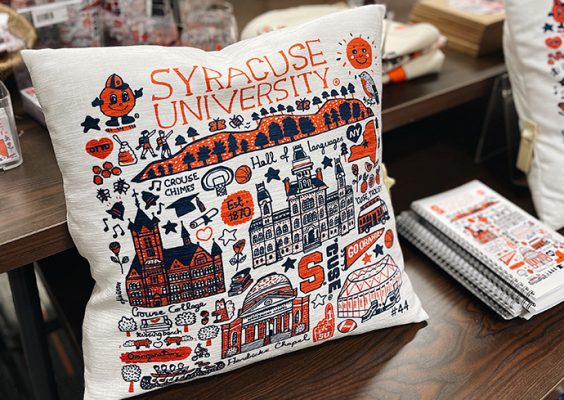 Pillow with an illustration of Syracuse University on it.