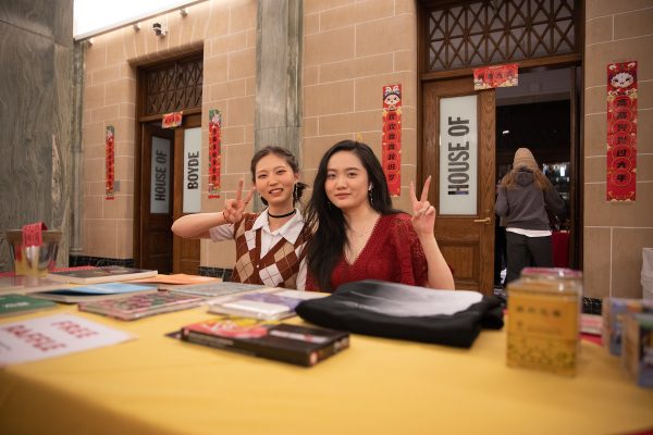 two students seated at a table at the School of Architecture Chinese New Year Celebration