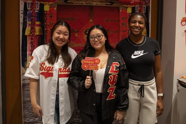 students pose together at the Orange After Dark/Center for International Services/