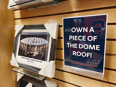 Campus store shelf with a framed photo of the Carrier Dome