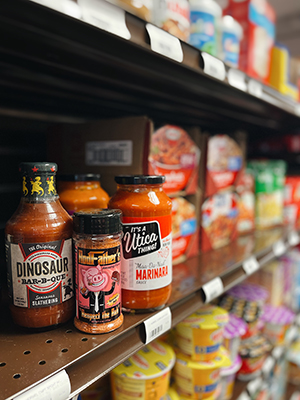 Various jars of sauces on a shelf