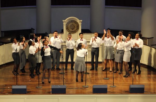 Students in the Black Celestial Choral Ensemble perform on the stage at Hendricks Chapel