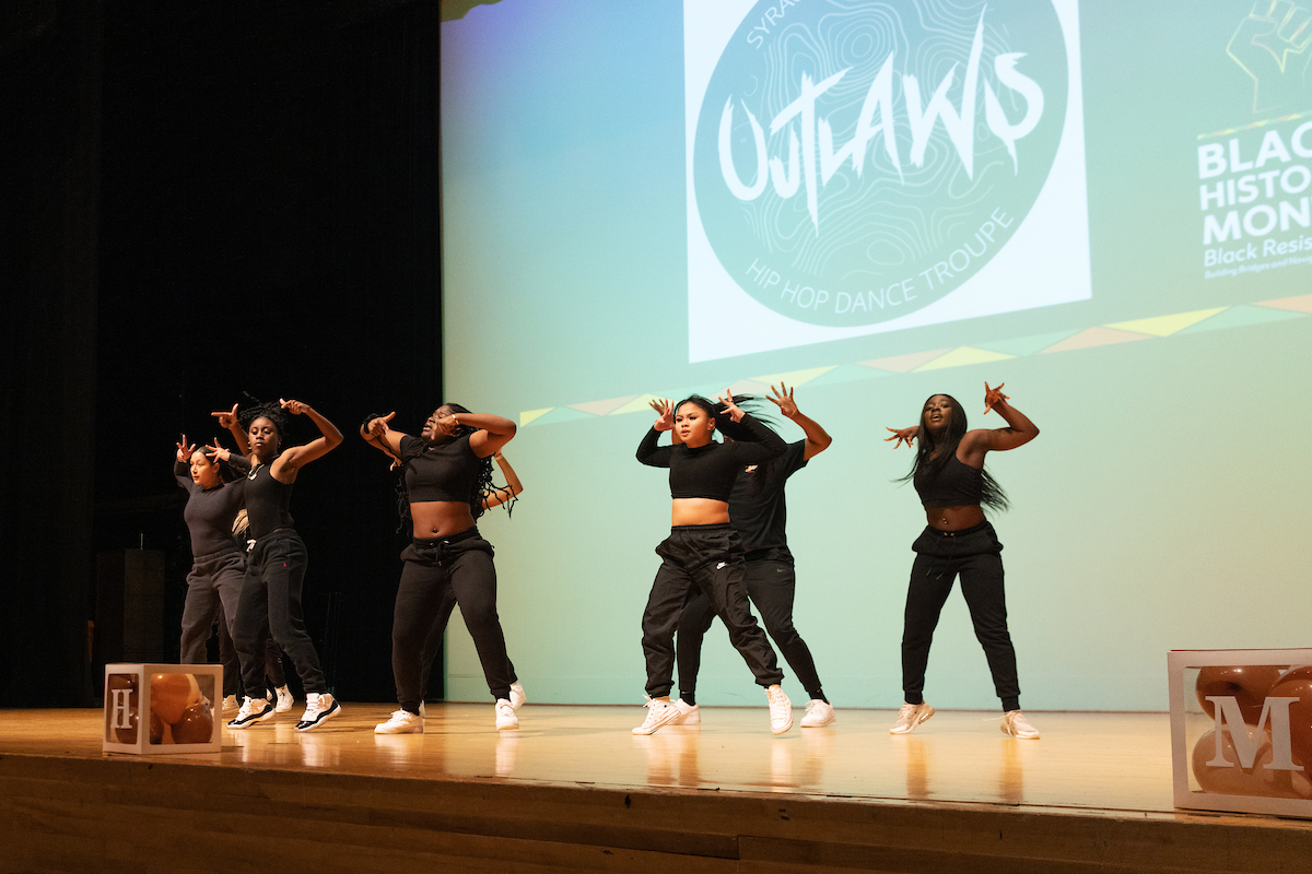 Outlaws dance troupe performs on stage at the Black History Month Kickoff Celebration