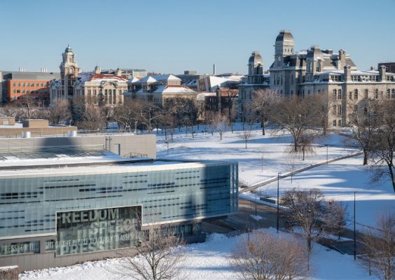 elevated winter scene of campus buildings looking toward Newhouse and Arts and Sciences buildings