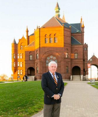 Bill Harris poses outside Crouse college