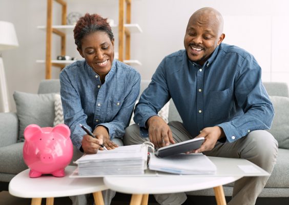 stock image of two people reviewing financial documents at a table