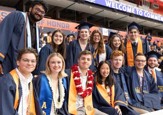 a group of graduates gather together at 2023 Commencement