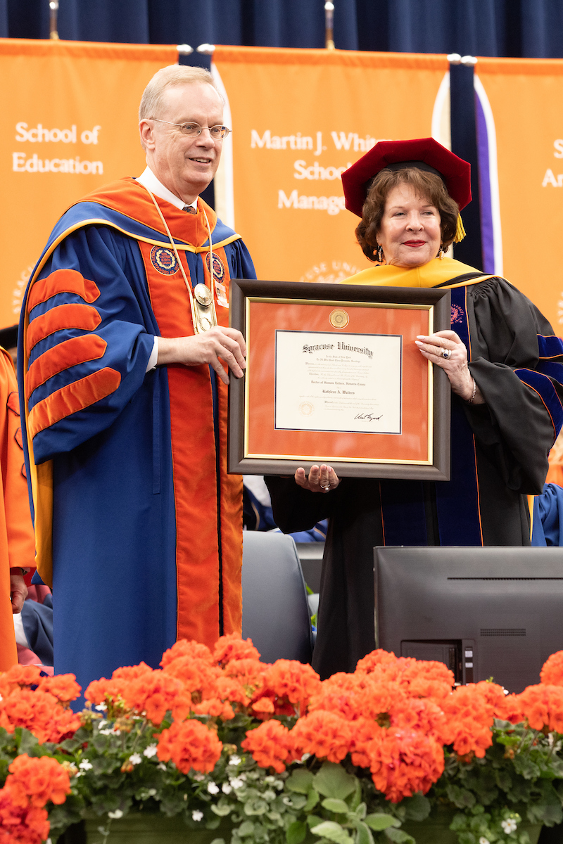 Chancellor Syverud and Kathy Walters ’73 pose as she receives an honorary degree at Commencement 2023