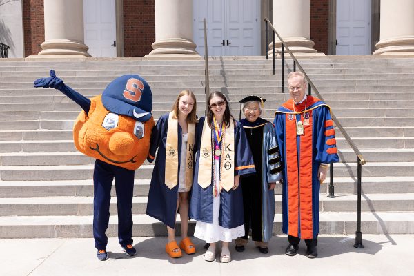 two students pose with Otto and Chancellor Syverud and Dr. Ruth Chen at Commencement 2023