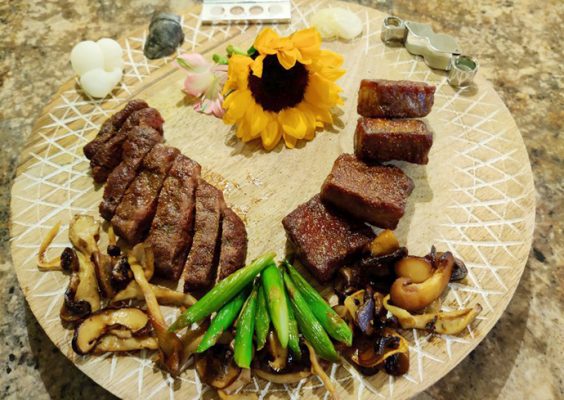 Enlarged 3-D prints of micro-fossils commonly used to study ancient ocean conditions during the extinction of dinosaurs are presented with a steak dish.