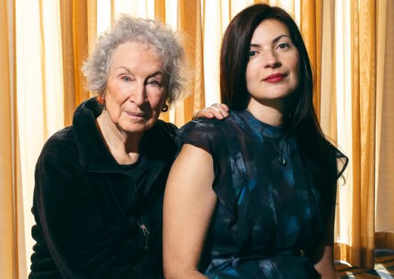 Author Margaret Atwood and Professor of English Mona Awad pose for a photo while seated indoors.