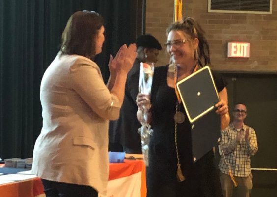 School of Social Work female student receiving an award