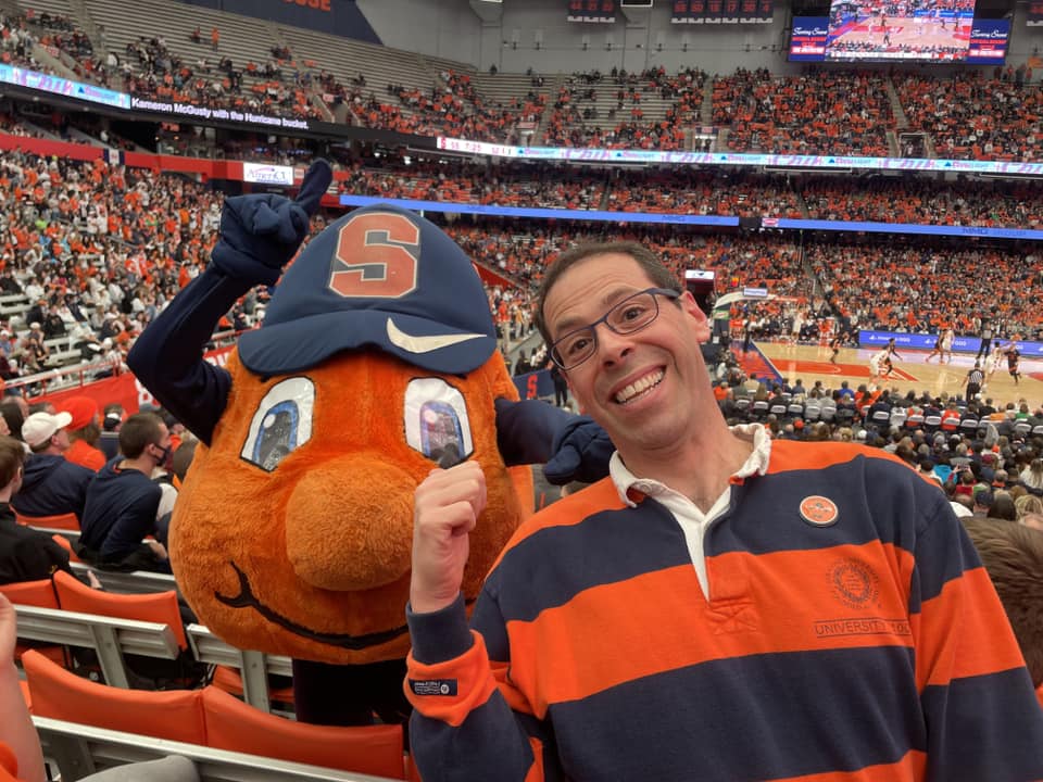 Individual with Otto at a basketball game in the Dome.