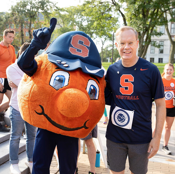 Otto posing with the Chancellor outside on a sunny day.