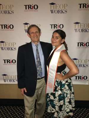 A Syracuse University advisor poses with a student.