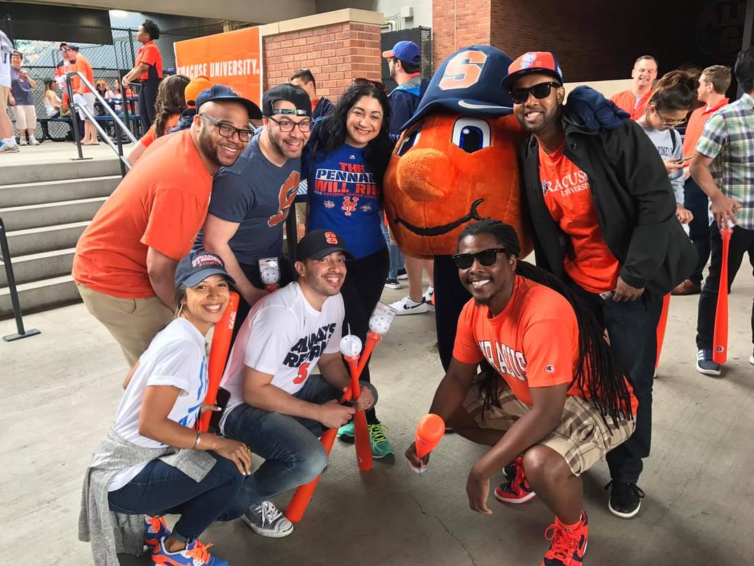 Otto with a group of people at a New York Mets game.