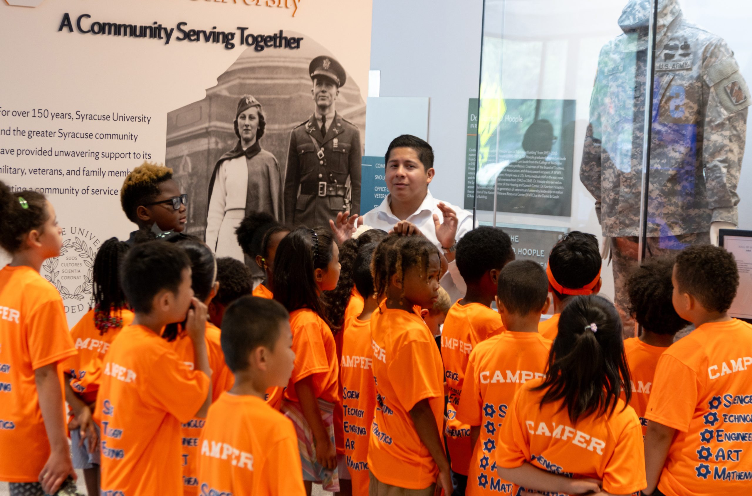 Group of children in orange tshirts on a tour of the NVRC. 