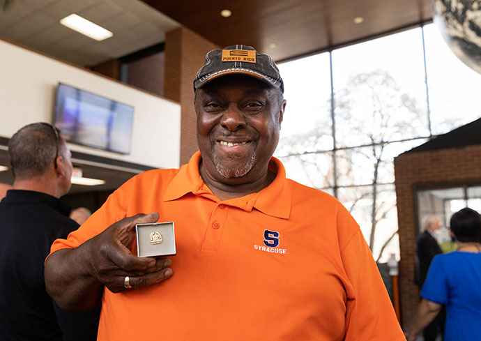 person holding a pin that states 50 years