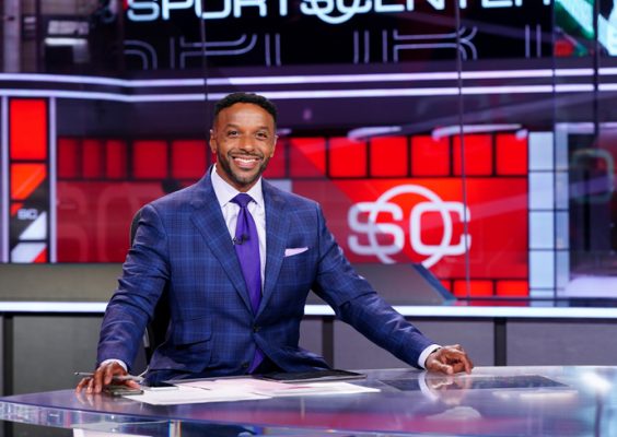 A man poses for a photo on the set of ESPN's "SportsCenter" program.