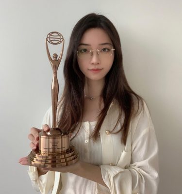 Victoria Lin ’22 holding her Bronze Clio Award