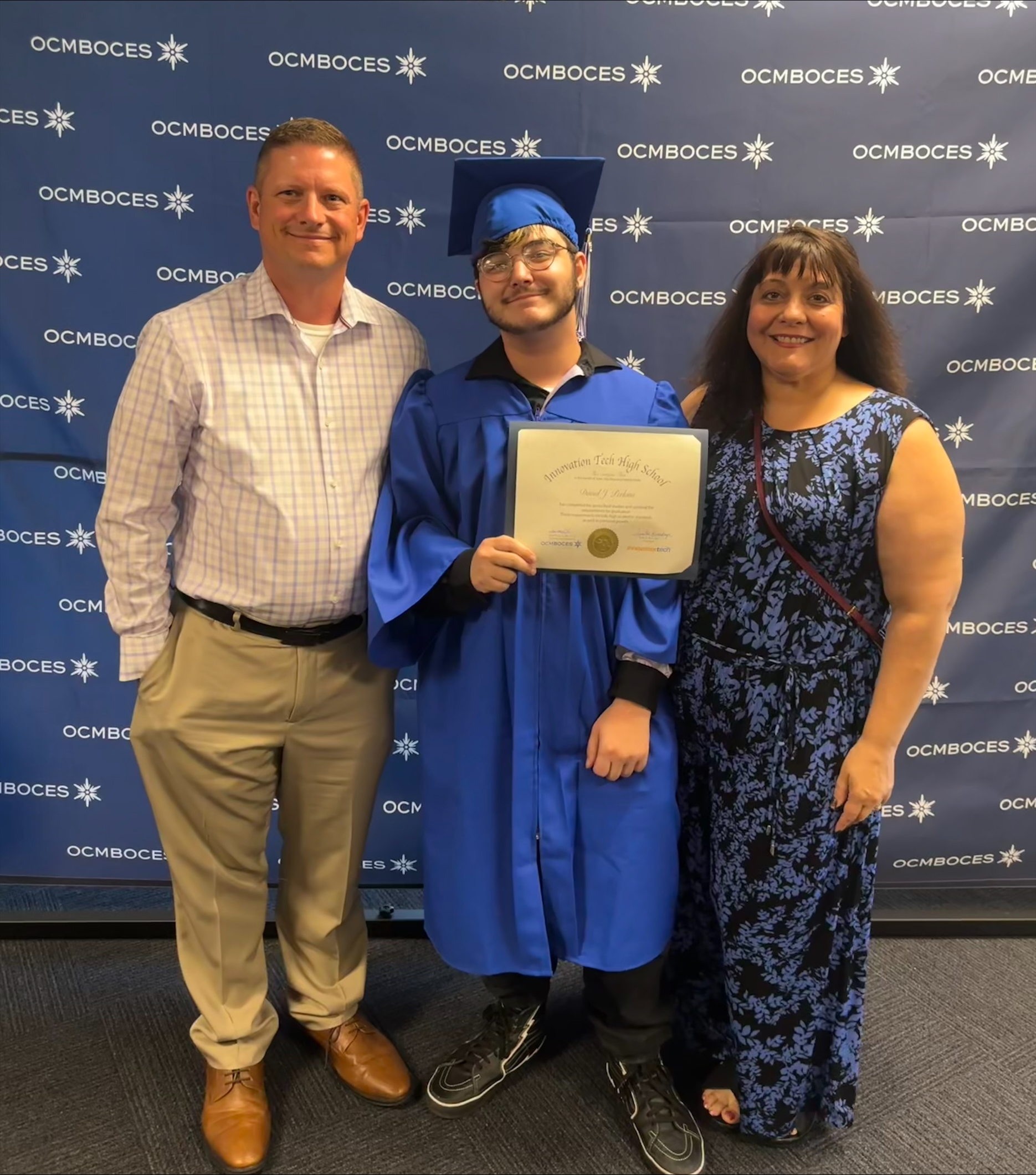 High School graduate with parents