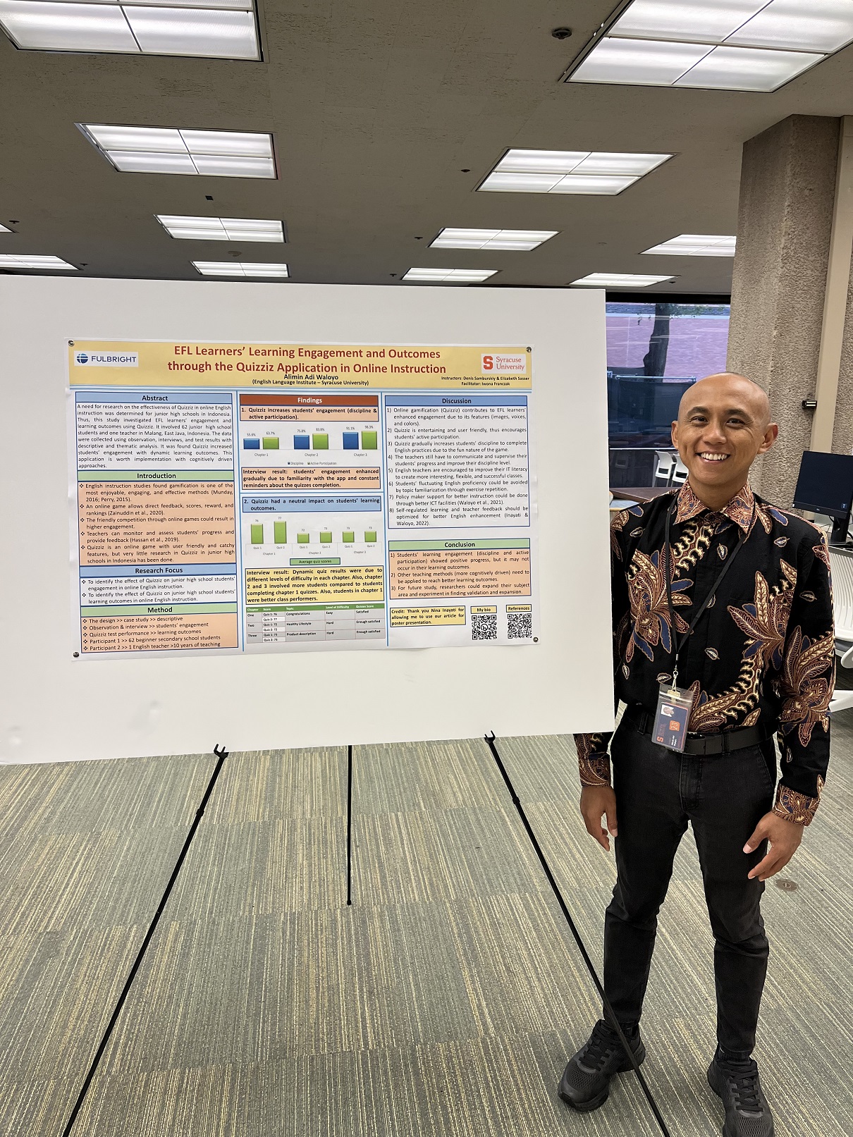 person standing next to research poster
