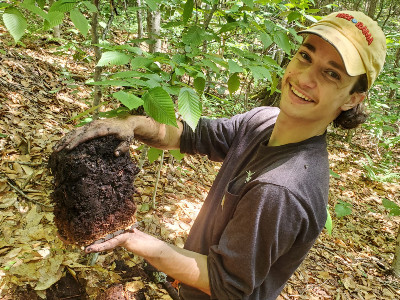 Student with a soil sample