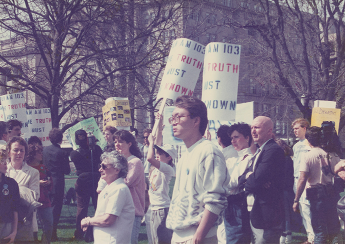 people walking with protest signs