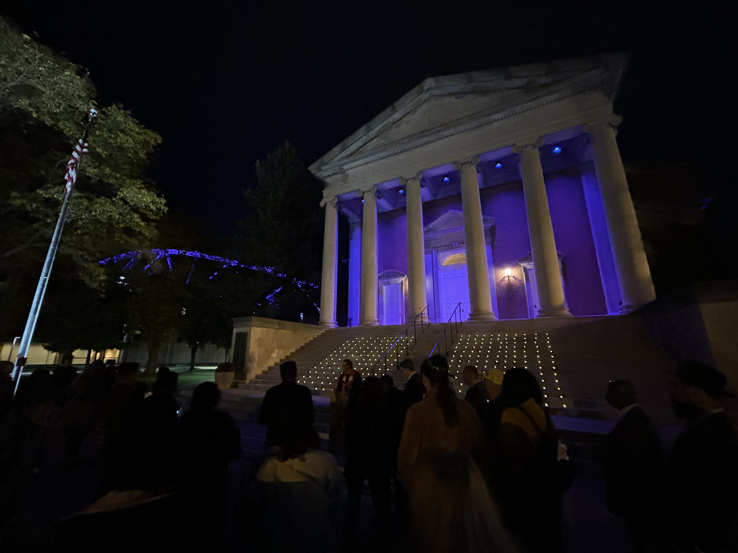 People gather for a prayer vigil in front of Hendricks Chapel.