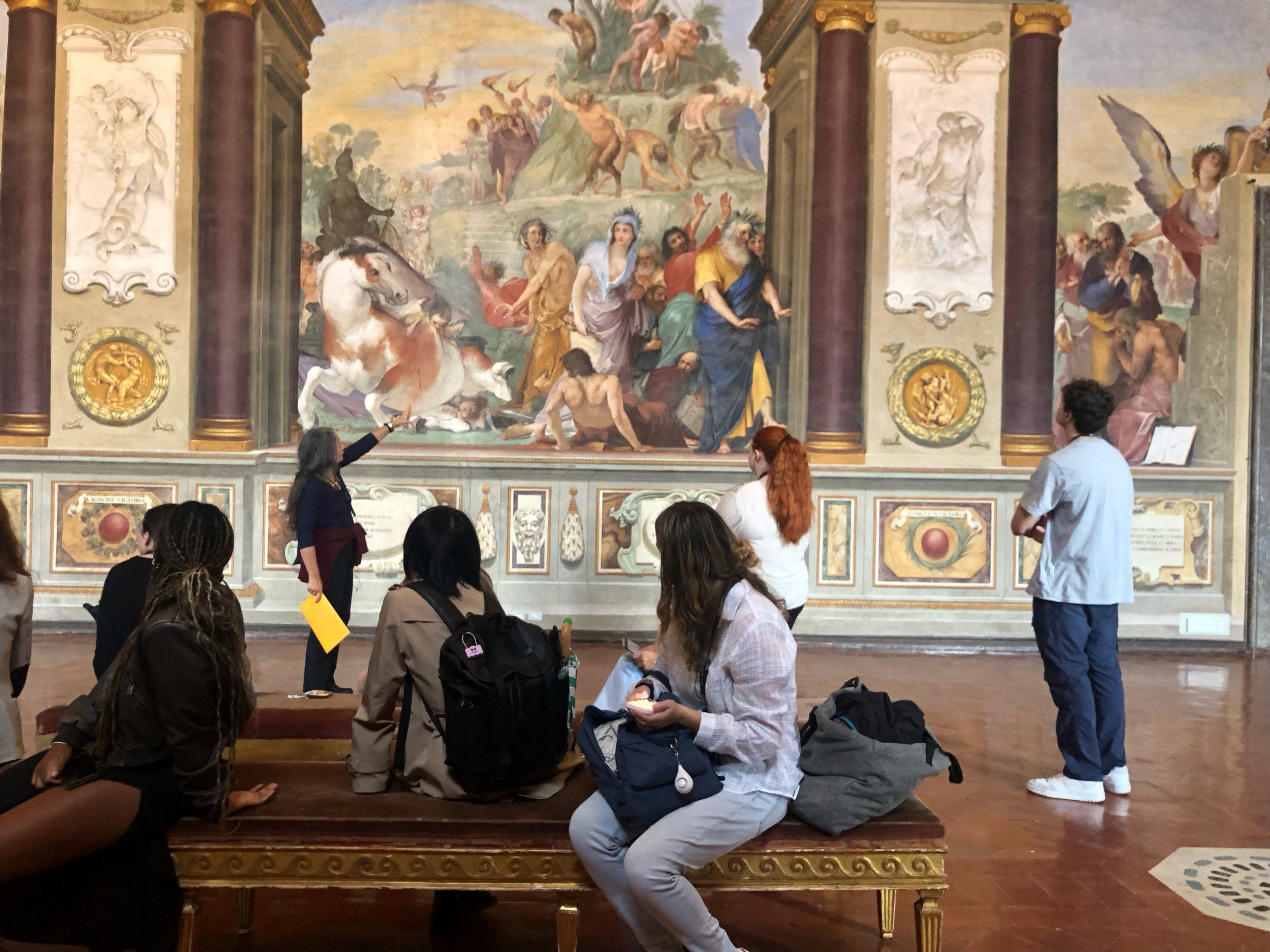 Students looking at art in a museum in Florence. 