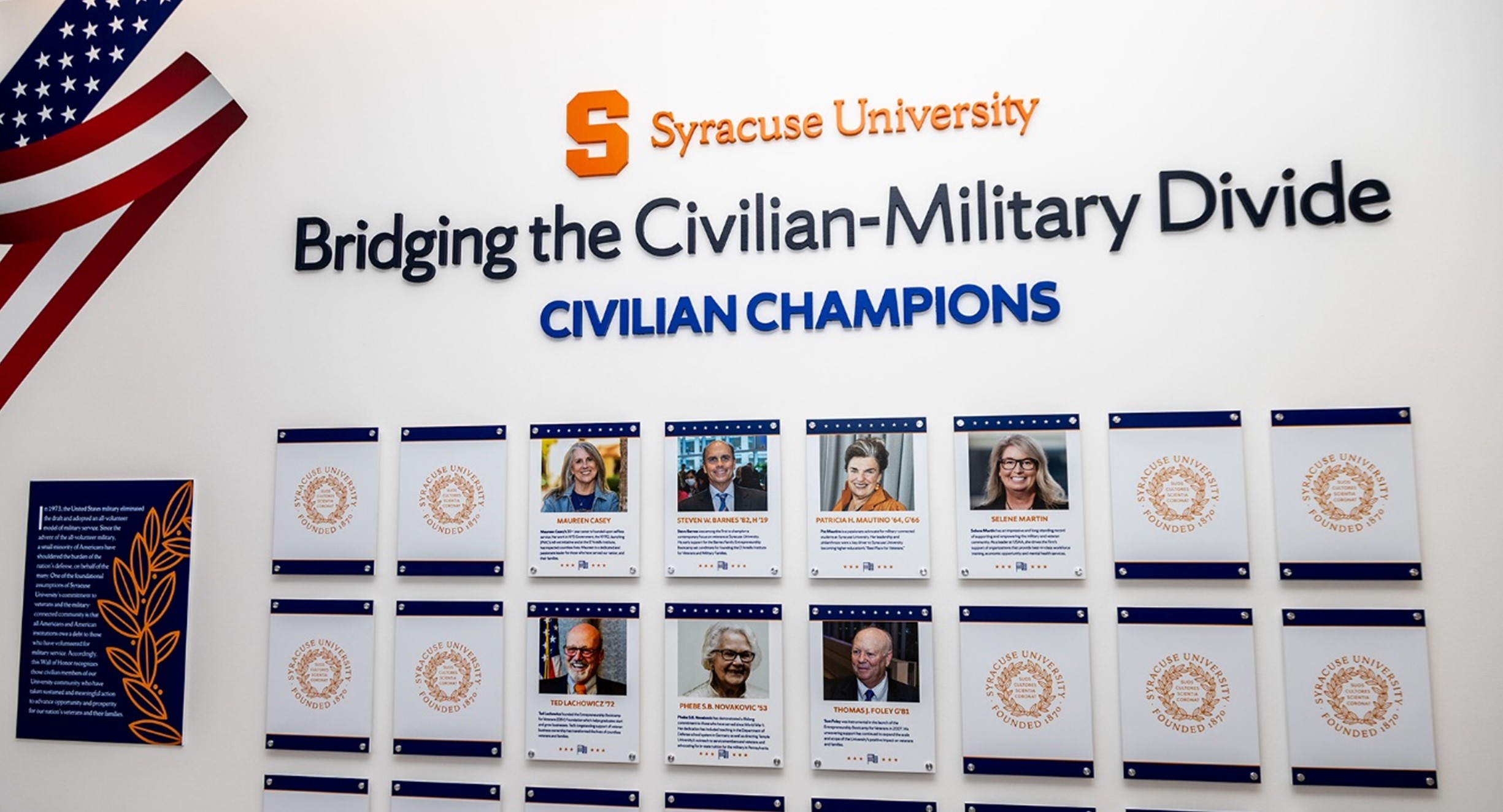 wall with plaques that states Syracuse University, Bridging the Civilian-Military Divide, Civilian Champions