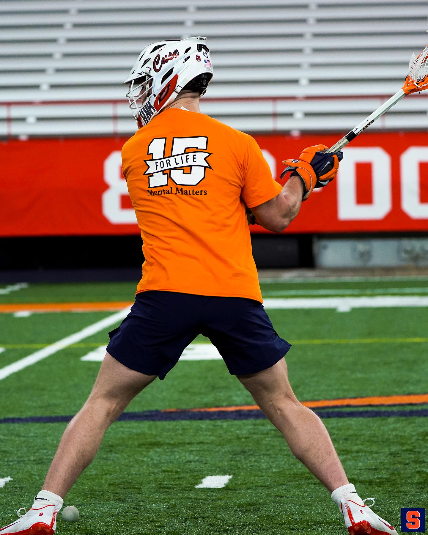 Men's lacrosse player getting ready to shoot the ball. 