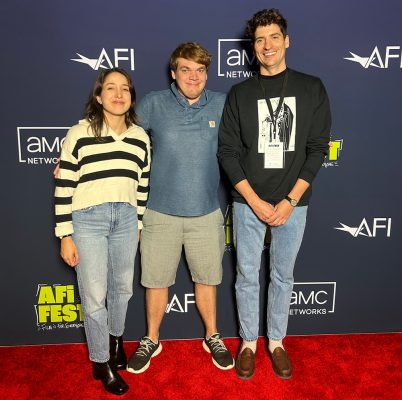 Alejandra Vasquez, Sam Clark and Sam Obsorn pose together on the red carpet at the American Film Institute festival