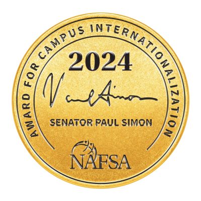 golden circle with words Award for Campus Internationalization, 2024, Paul Simon, Senator Paul Simon, NAFSA