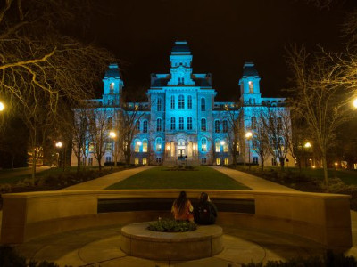 Hall of Languages lit in teal