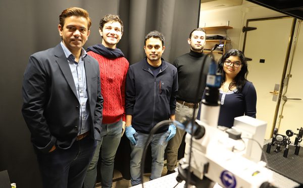 Professor Jha with the members of his research group.