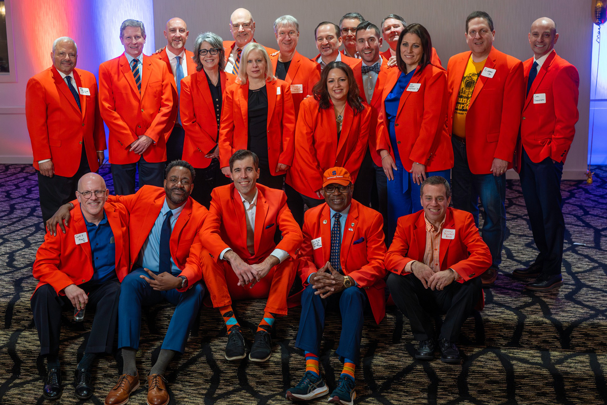 Members of the WJPZ Hall of Fame pose while wearing their Orange jackets.