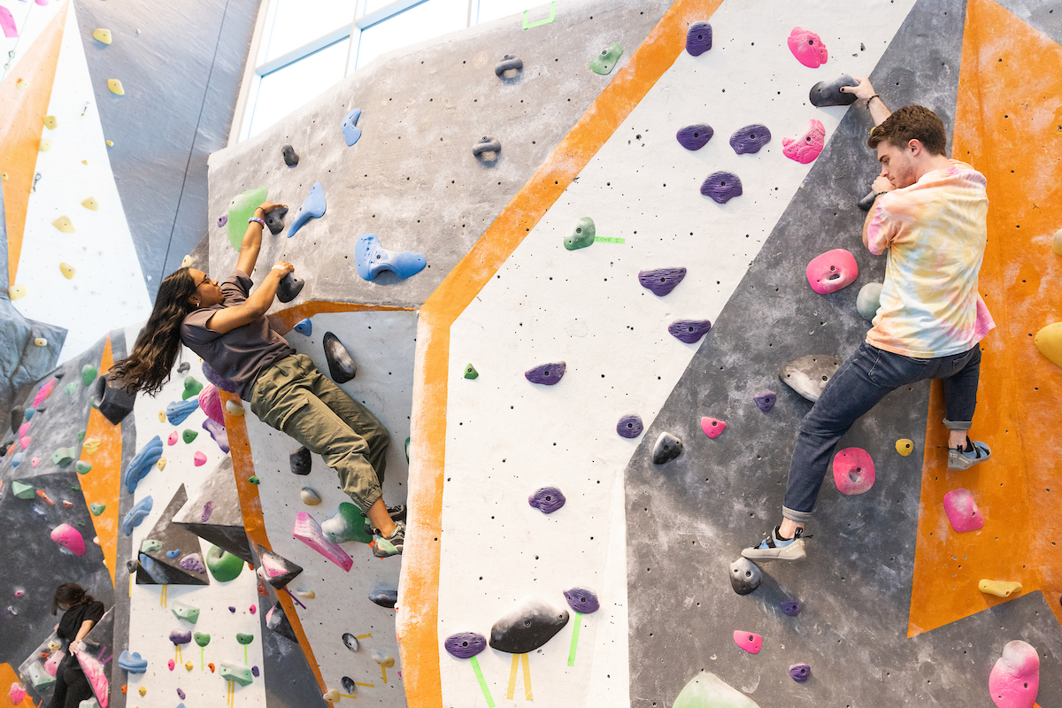 Student students climbing a rock wall
