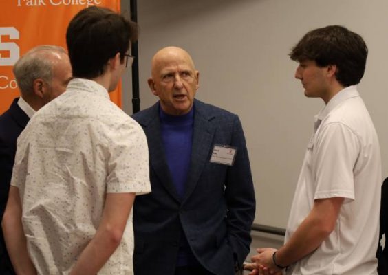 Falk College benefactor David Falk with students.
