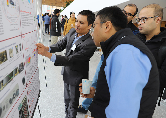 A student researcher explains his poster presentation during the College of Engineering and Computer Sciences' annual Research Day.