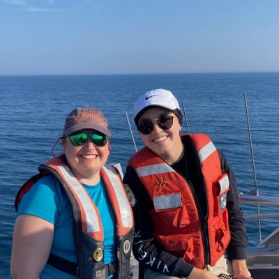 Two researchers on a boat in the Atlantic Ocean off the coast of Massachusetts.