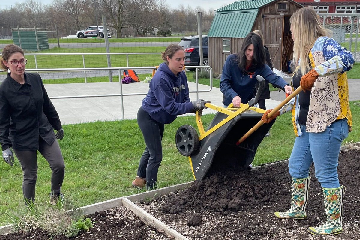 Students prepare the gardening beds for seeds and seedlings that will be planted in late May.