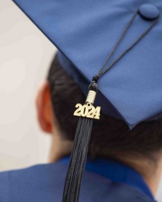 a person wearing a mortarboard with 2024 tassel