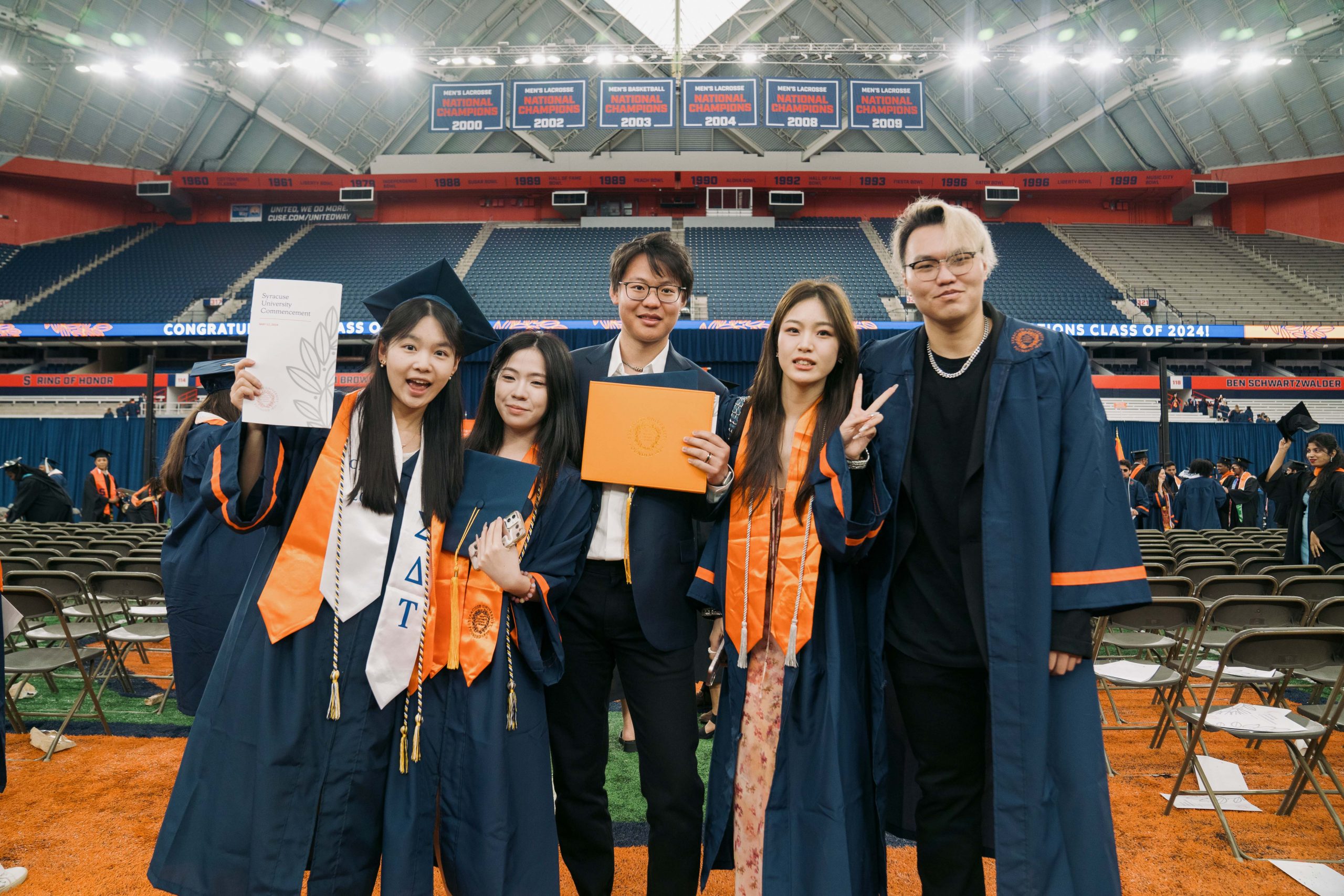 Five students standing together after Commencement 