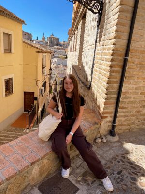 A woman poses for a photo while studying abroad in Spain.