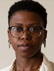 Headshot of person in glasses