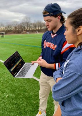 Sport Management student Dan Griffiths working with Syracuse track and field team.