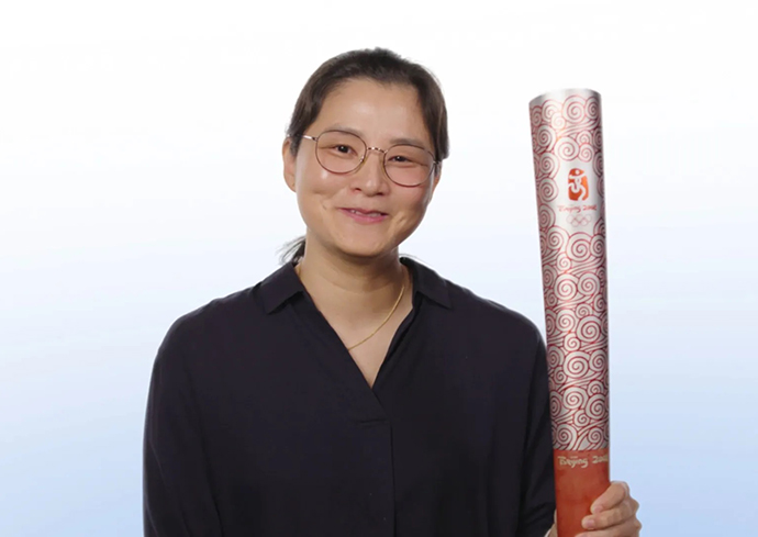 person holding Olympic torch